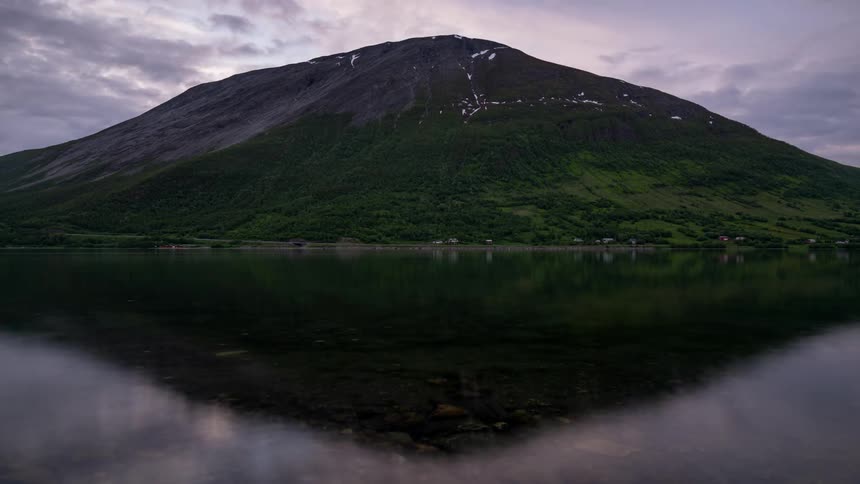 Mountain and the clouds reflecting off the fjord