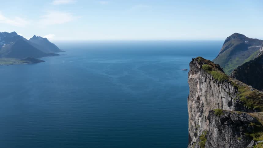 A sheer rock wall cliff by the ocean