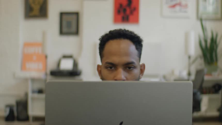 Man works on a computer in the office during the daytime