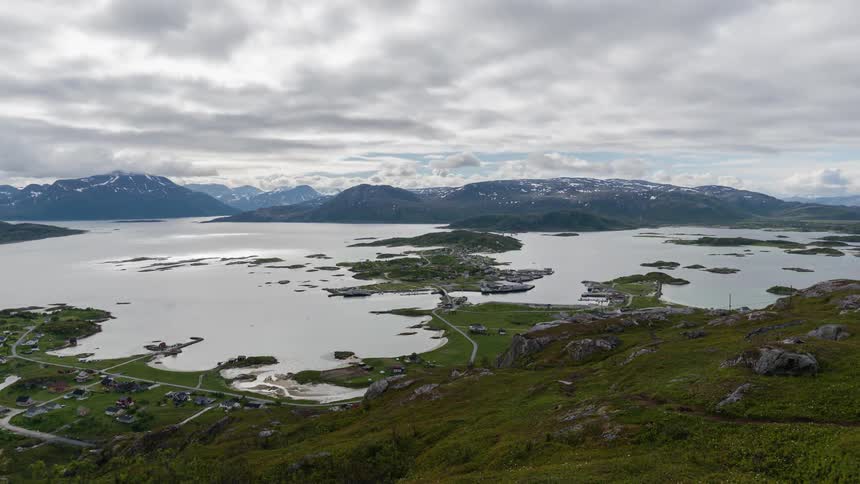 Clouds flowing over sea and mountain islands