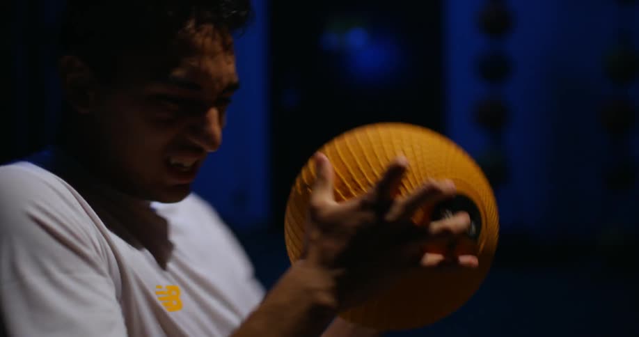 A man works out with an exercise ball