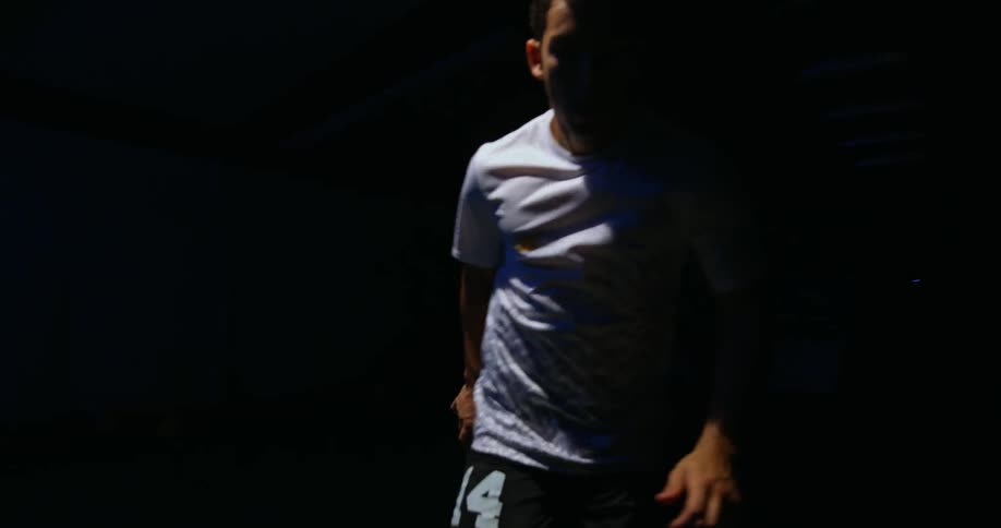 A man is running around in the dark