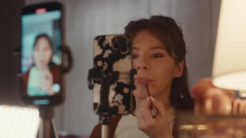 Woman streams herself while she puts on makeup