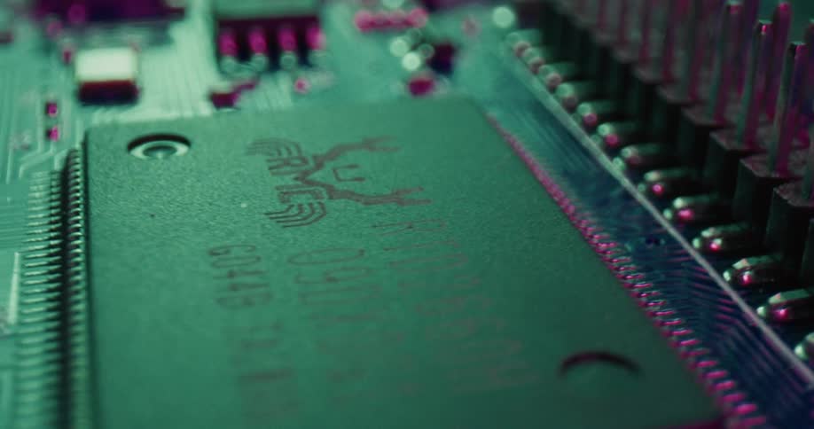 Microchip integrated into a circuit board with traces and aligned metal pins