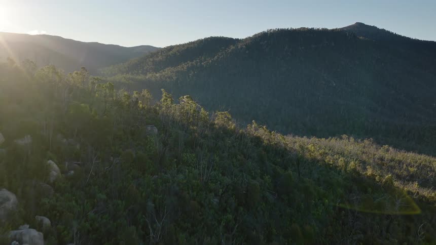 Sun is shining on the green mountain range