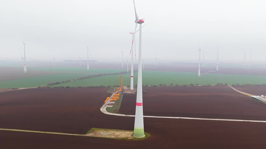An aerial view of some windmills outdoors