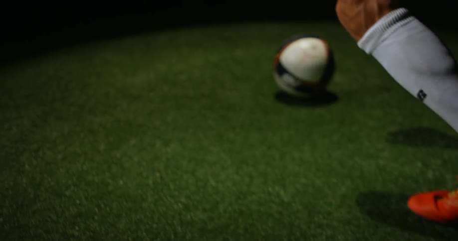 A man plays soccer in a field