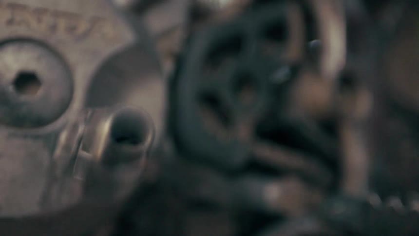 A close up shot of a foot moving the pedal on a motorcycle