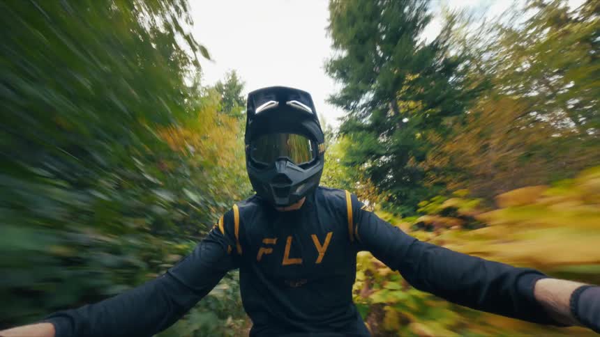 A man riding a dirt bike outdoors