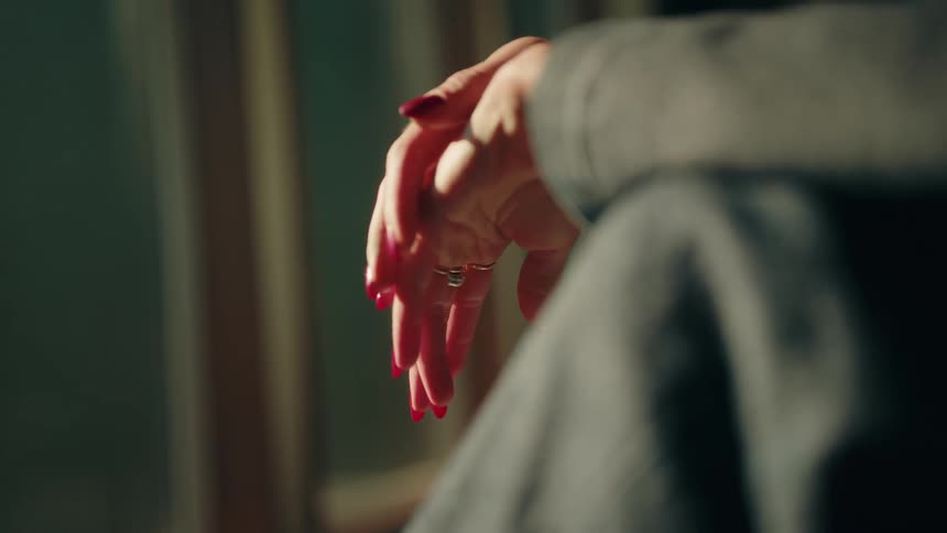 A close up of a womans nails