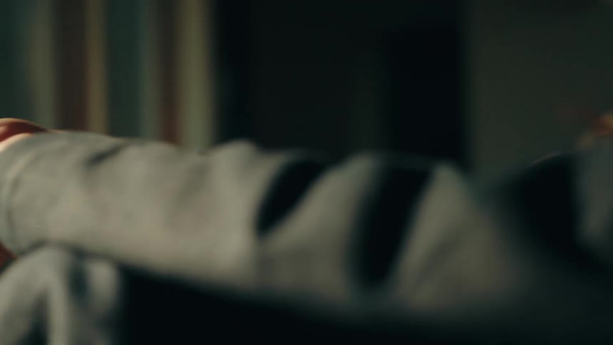 Profile view of a womans face lit by natural light in an indoor setting