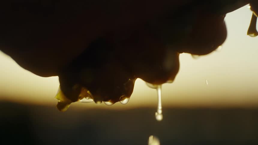 A close up of a persons hands that are wet