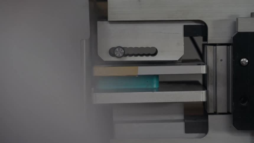 The person puts an object in the machine