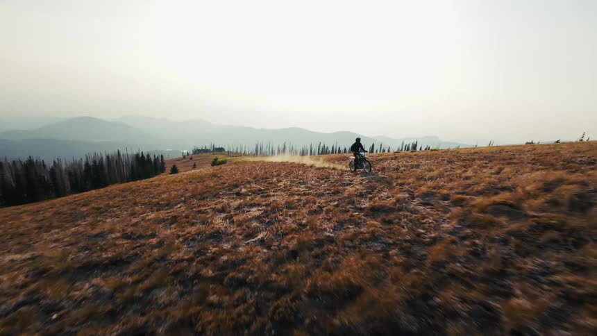 A person riding a motorcycle on a field