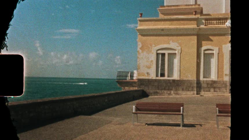 A view of a villa along the edge of a coast