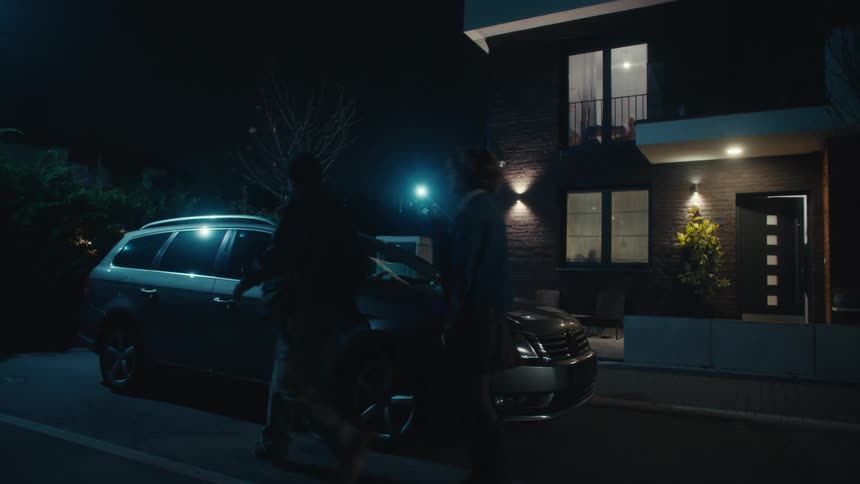 Man opening the car door for woman to get in