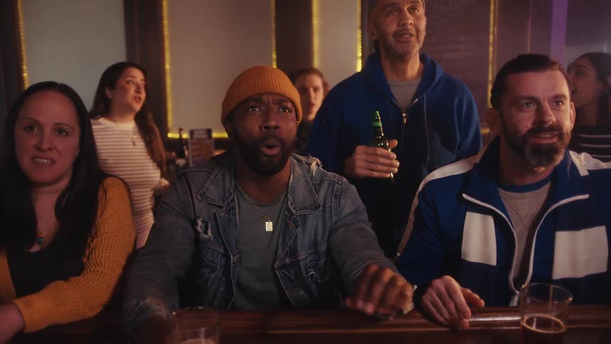 The patrons of the bar talk and have fun