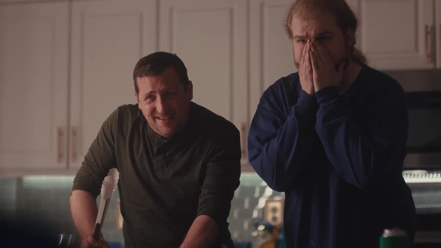 The man cheers and consoles his friend