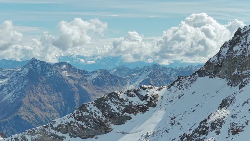 The landscape is covered with tall mountains