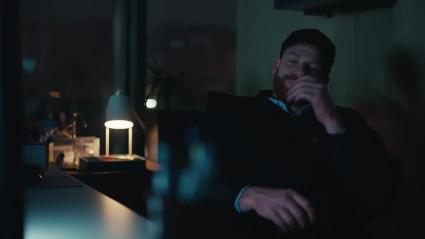 An employee falling asleep in an office