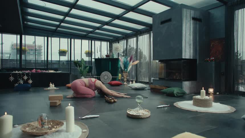 The woman does yoga on the mat