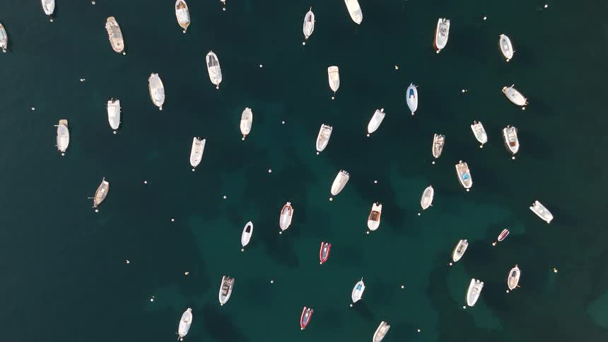 An aerial view of boats floating on water