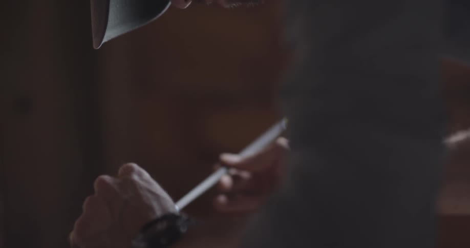 A man holds and rotates an arrow