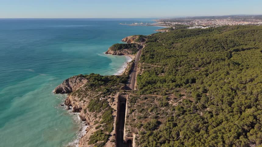Train tracks run along the coast line