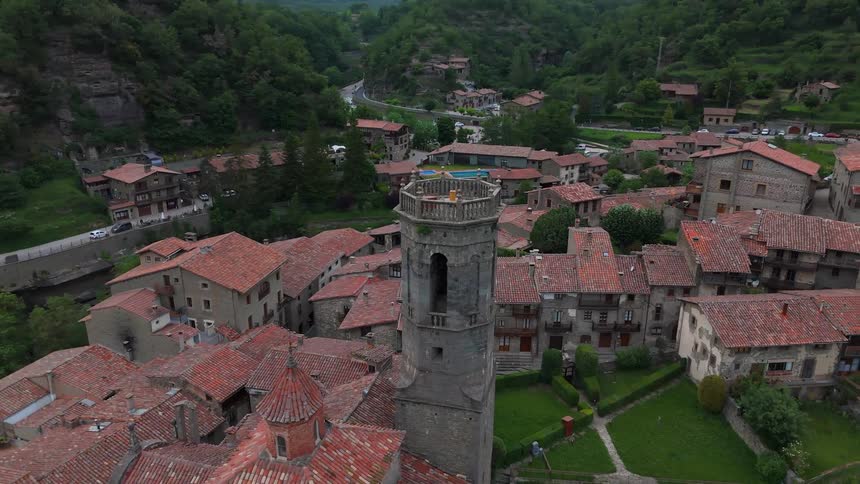 An old tower rises up in a small rural town