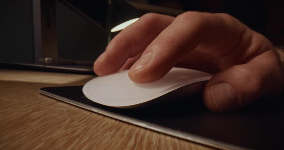 Zooming in on a person clicking a mouse