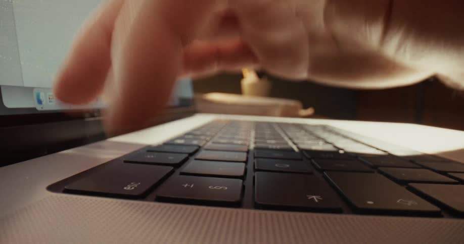 A person is hitting one key over and over on a laptop