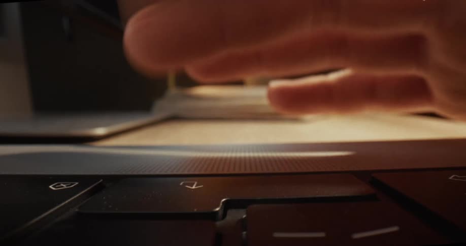 The person is repeatedly pressing the enter button on the laptop