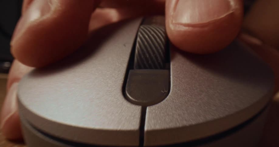 A person using a mouse on a table