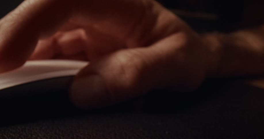 A person using a mouse in a room