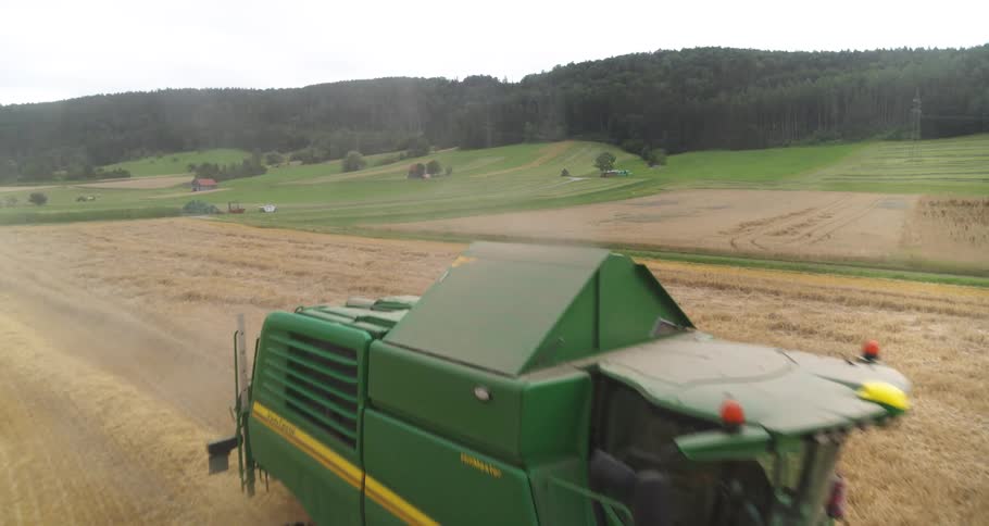 Agricultural harvester moving through a grain field during harvesting