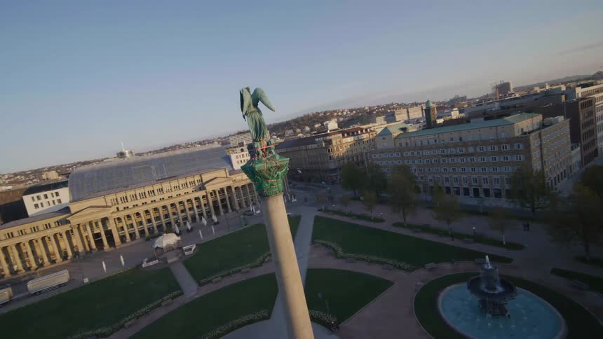 An aerial view of a tower in a large city