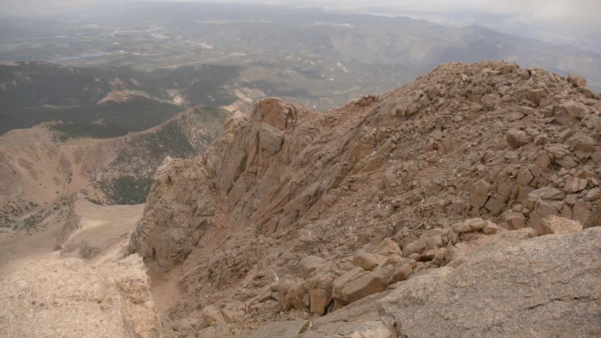 A rocky mountain ridge is shown in the wilderness