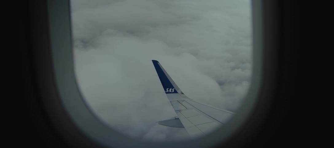 The plane is flying high above the clouds