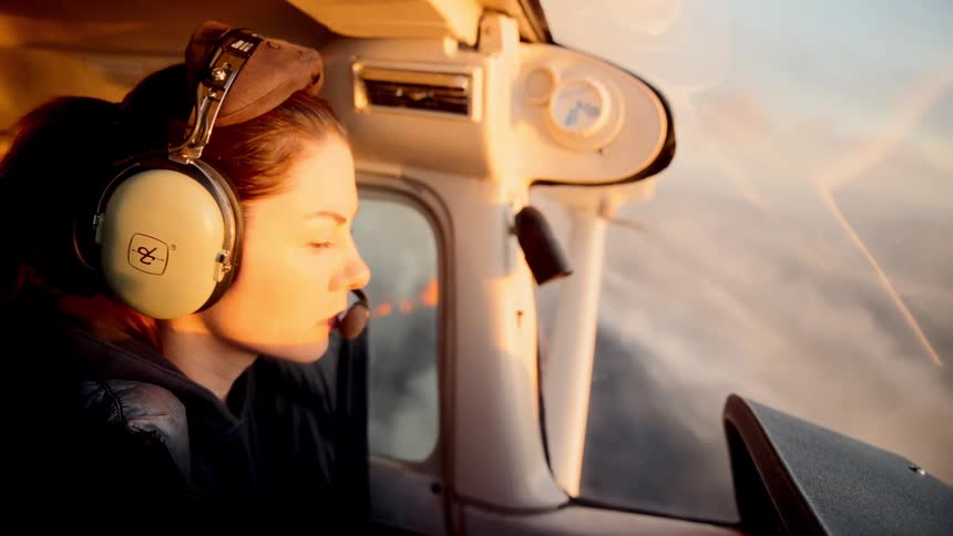 A woman flying a small plane