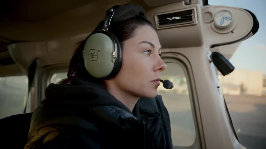 A woman getting ready to fly a plane