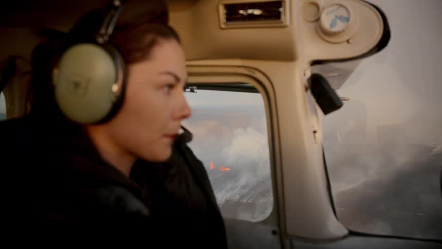 A woman flying a small plane