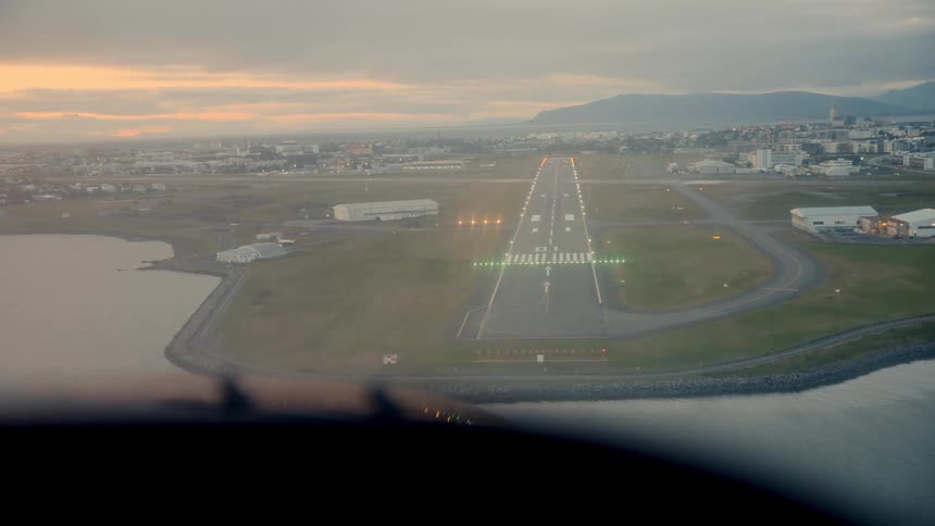 A plane landing at an airport