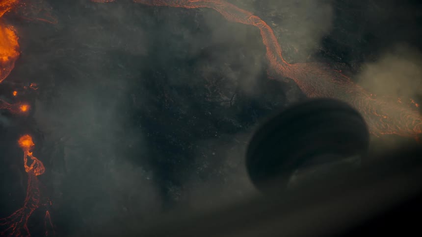 The plane flies over the erupting volcano
