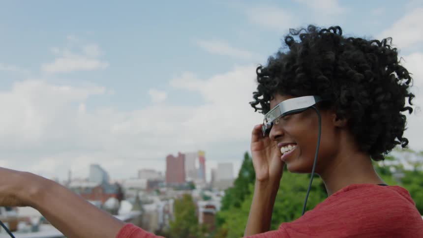 A woman looks out with vr glasses