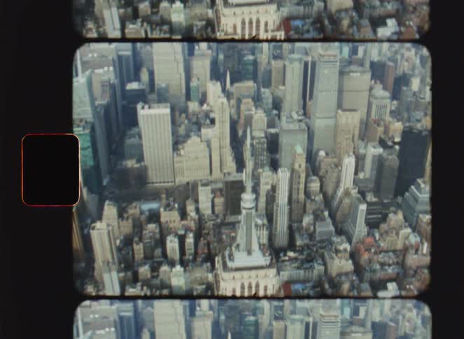 A city skyline filled with a series of tall skyscrapers all standing sharply against the bright midday light