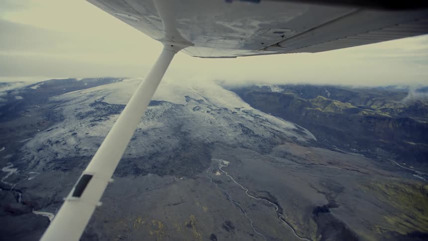 The long plane wing glides in the sky