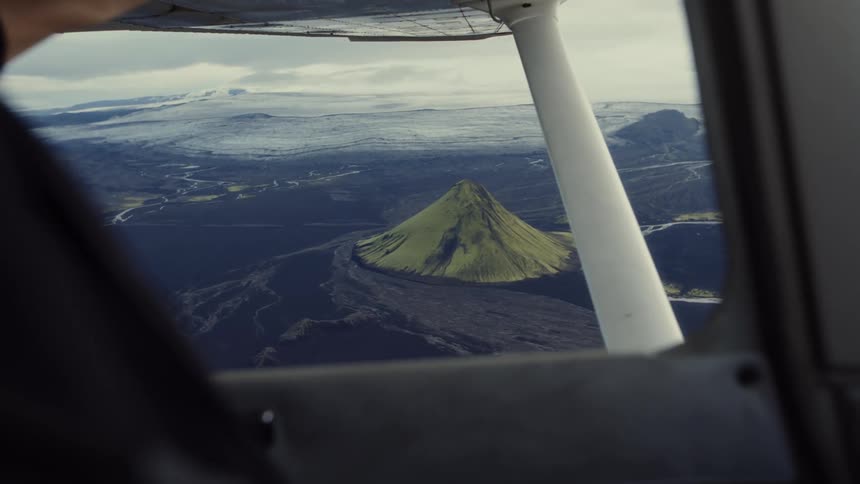 The pilot opens the window in the flying plane