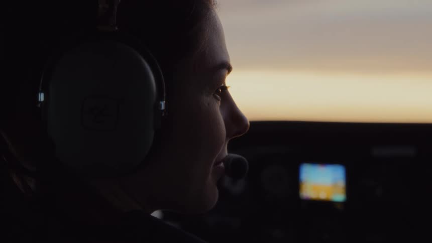 The pilot laughs in the cockpit