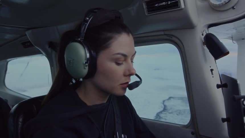 Woman pilot flying a small airplane