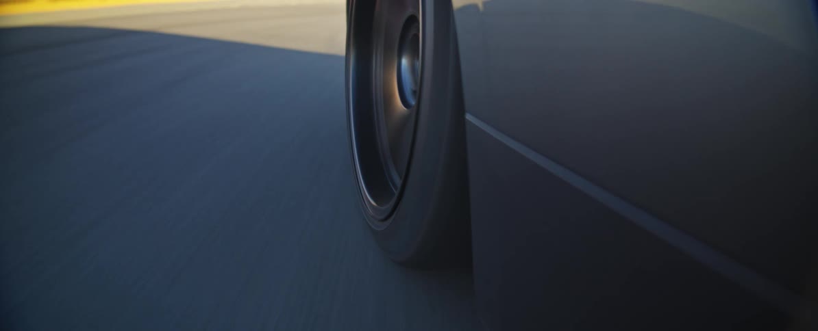A vehicle drifting filmed from the side of the car